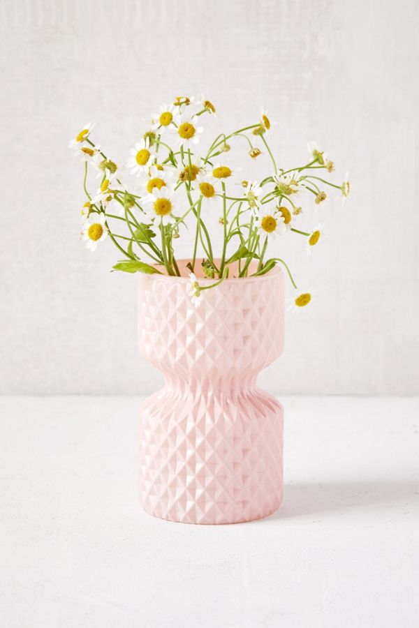 pink vase with chamomile flowers