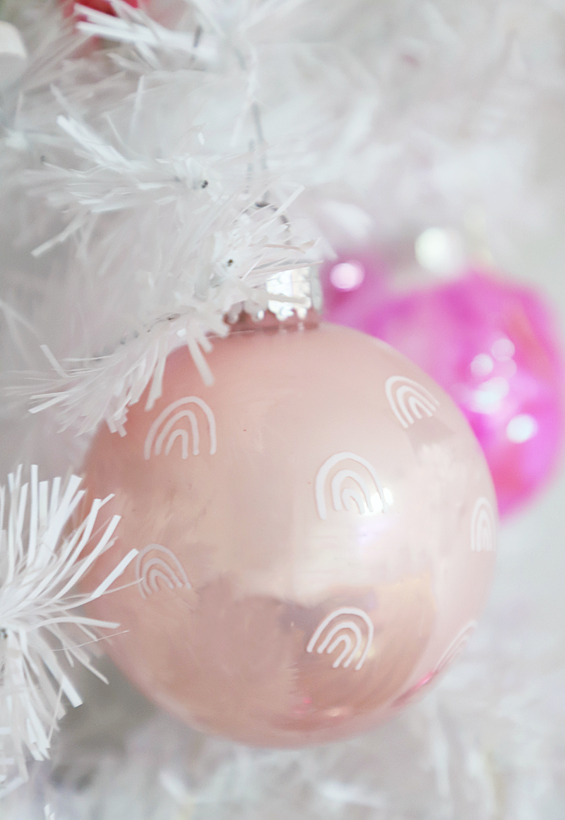 pink ornaments with white rainbows