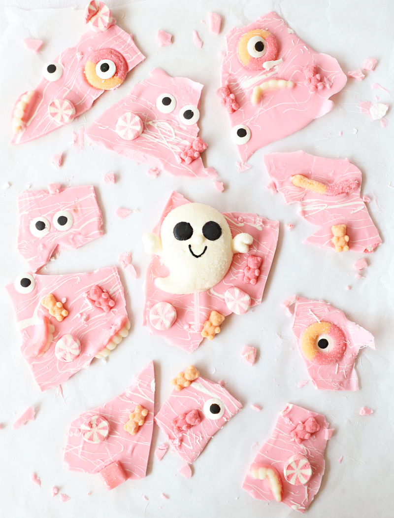 pink halloween candy bark with tons of pink and pastel colored candies & a white ghost
