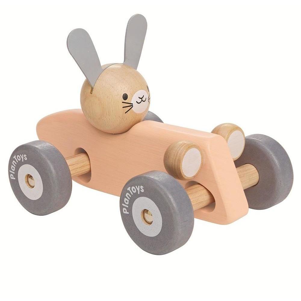 bunny in a pink racing car